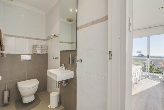 Master bedroom's en suite bathroom offers shower facilities.