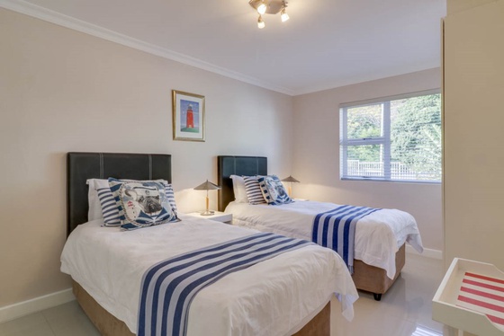 Second bedroom offers two single beds that can be converted into a king sized bed.
